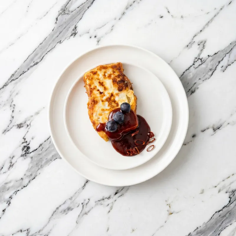 Pan-fried goat cheese with a berry sauce
