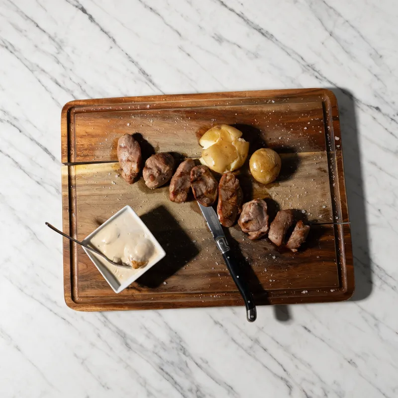 Pork fillet served with tender potatoes and a creamy dip